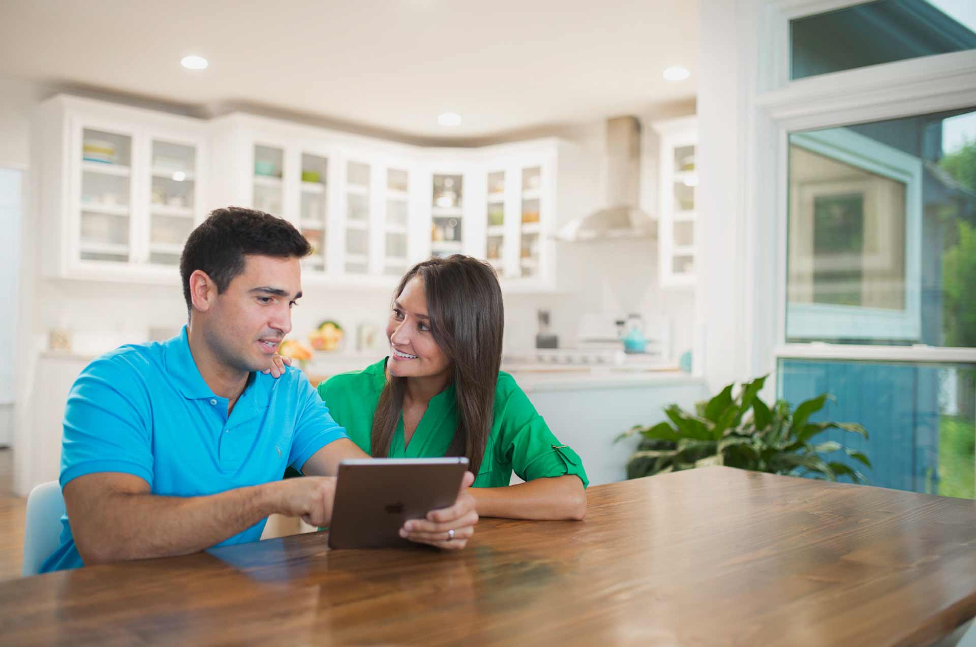 benefits-administration-new header image_people using tablet at home