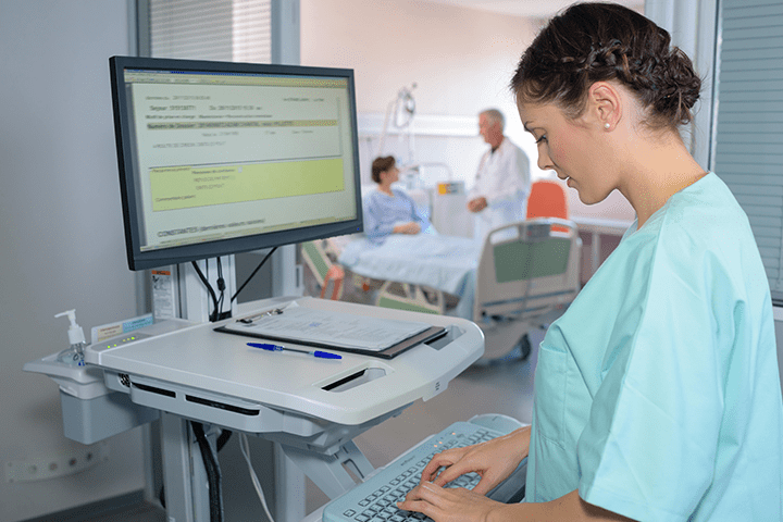 Nurse using computer system at a hospital.